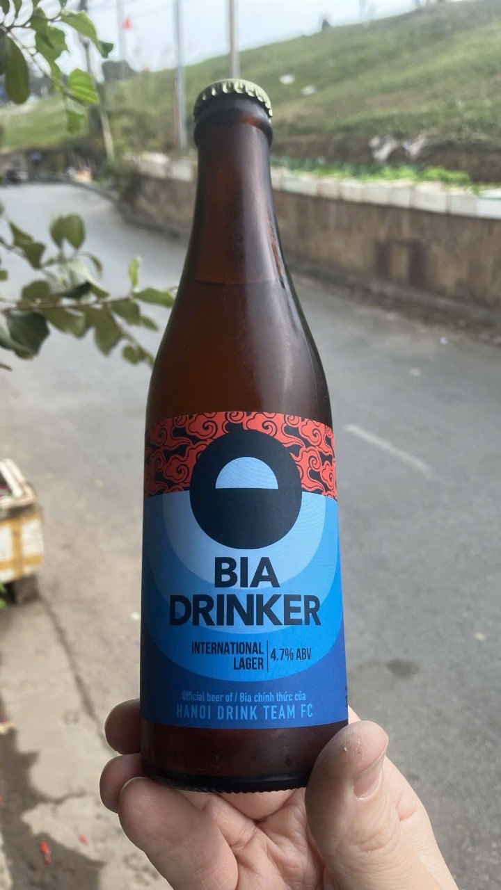A bottle of Bia Drinker, International Lager 4.7% ABV, official beer of Hanoi Drink Team FC